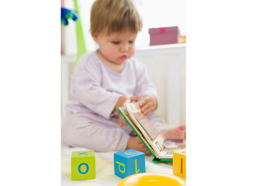 Kid learning busy book with building blocks